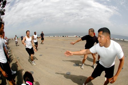 US Navy 070309-N-0209M-002 Sailors assigned aboard amphibious assault ship USS Boxer (LHD 4) participate in a 5K Captain's Cup relay race held on the ship's flight deck