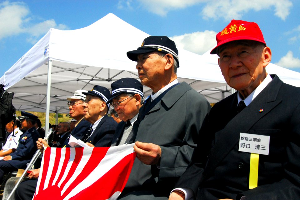 US Navy 070314-N-4124C-007 Japanese survivors of the Battle of Iwo Jima sit together at the 62nd Commemoration of the Battle of Iwo Jima held overlooking invasion beach