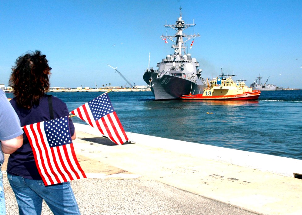US Navy 070307-N-1522S-074 Family members look on as guided missile destroyer USS Roosevelt (DDG 80) departs for deployment