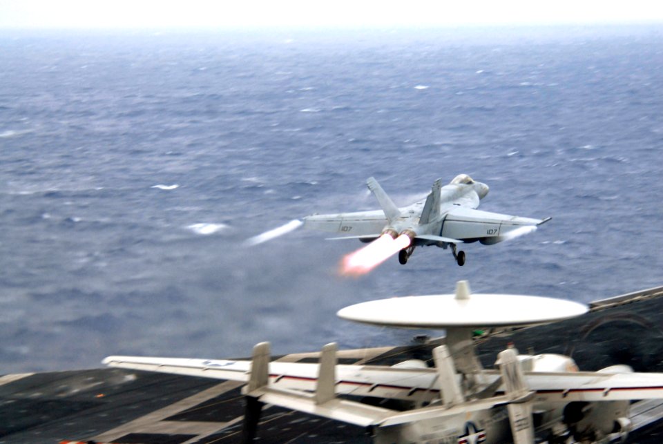US Navy 070305-N-3659B-092 An F-A-18E Super Hornet, assigned to the Fighting Redcocks of Strike Fighter Squadron (VFA) 22, takes flight on a re-fueling mission