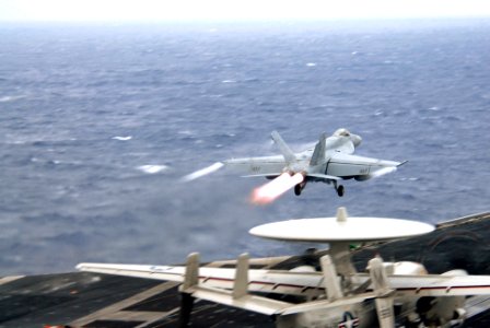 US Navy 070305-N-3659B-092 An F-A-18E Super Hornet, assigned to the Fighting Redcocks of Strike Fighter Squadron (VFA) 22, takes flight on a re-fueling mission