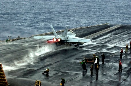 US Navy 070305-N-7130B-060 An F-A-18E Super Hornet, assigned to the Fighting Redcocks of Strike Fighter Squadron (VFA) 22, rockets down the number two steam powered catapult track