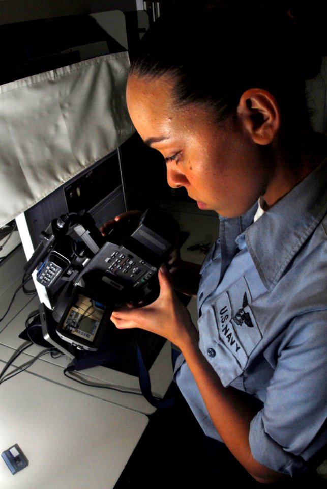 US Navy 070310-N-9928E-029 Mass Communication Specialist Seaman Leah Allen reviews recorded video footage in preparation for digitizing and b-roll production in media department's video workshop