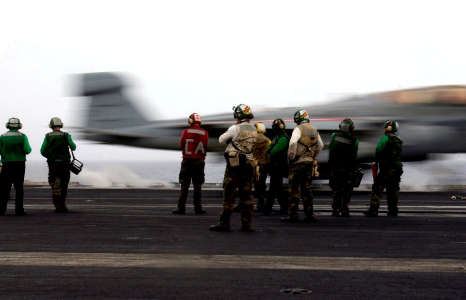 US Navy 070315-N-7130B-152 In a blur, an E-A-6B Prowler, assigned to the Cougars of Tactical Electronic Warfare Squadron (VAQ) 139, launches from the flight deck of USS Ronald Reagan (CVN 76) as ground crew member