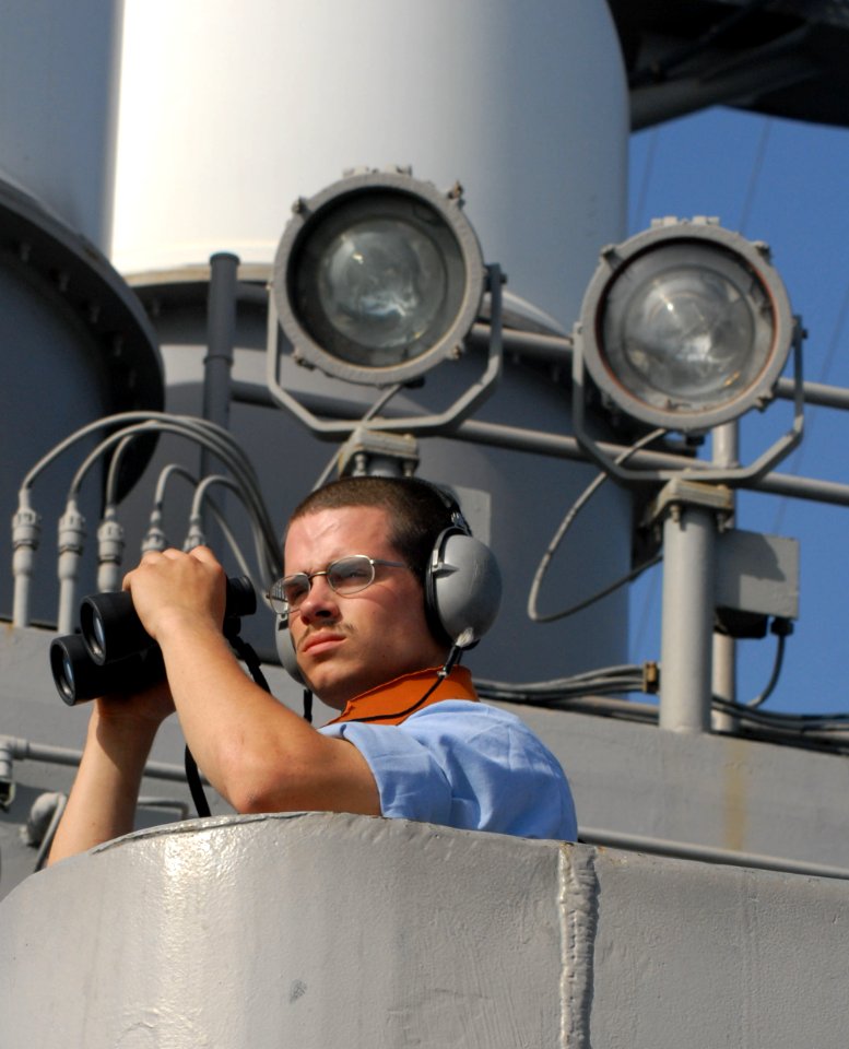 US Navy 070313-N-3038W-607 Seaman Christopher Cardenes stands the aft lookout watch on the signal bridge aboard Nimitz-class aircraft carrier USS John C. Stennis (CVN 74)