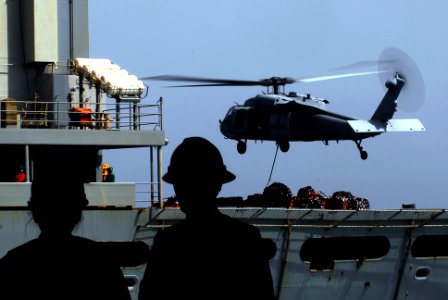 US Navy 070309-N-9928E-093 An HH-60H Seahawk transports pallets between Military Sealift Command (MSC) fast combat support ship USNS Bridge (T-AOE 10) and Nimitz-class aircraft carrier USS John C. Stennis (CVN 74) during a repl