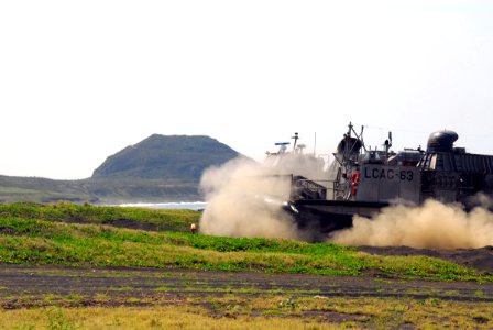 US Navy 070313-N-4124C-132 A landing craft air cushion (LCAC), assigned to dock landing ship USS Harpers Ferry (LSD 49), arrives at the black-sand beach of Iwo Jima