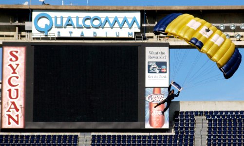 US Navy 070308-N-4163T-011 A member of the U.S. Navy Parachute Demonstration Team Leap Frogs begins his descent into San Diego's Qualcomm Stadium as part of a training session