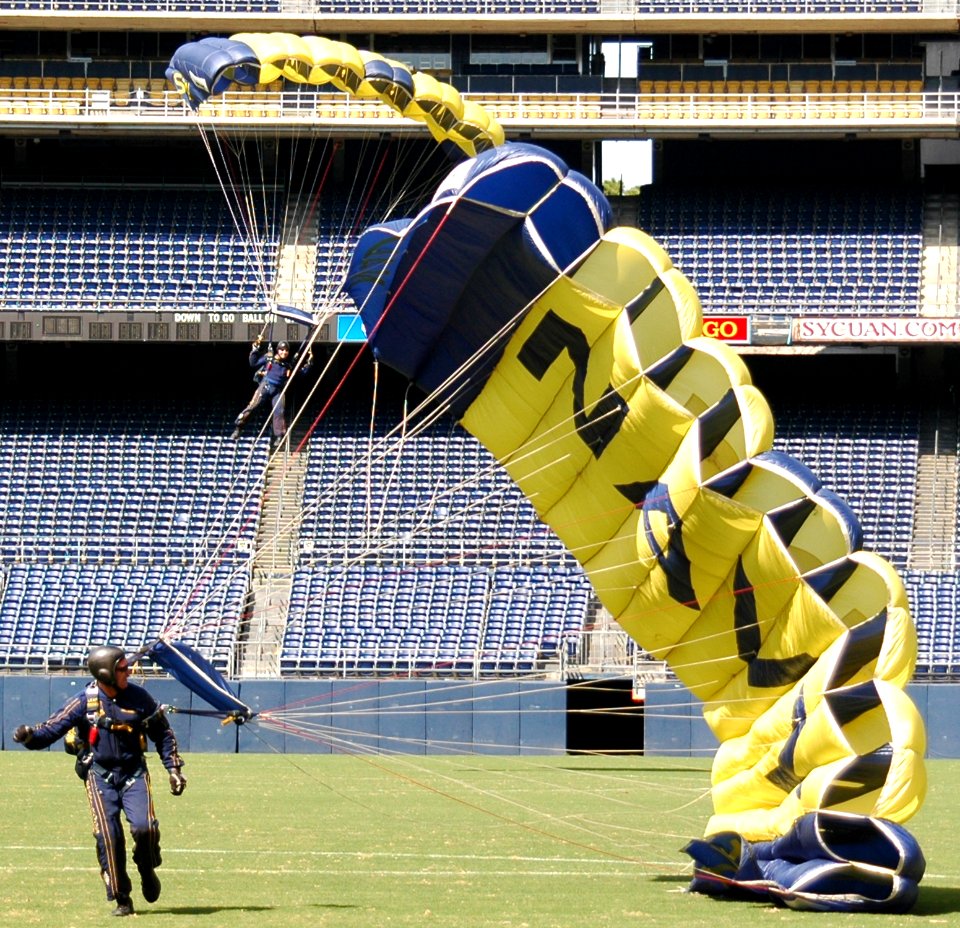 US Navy 070308-N-4163T-328 Two members of the U.S. Navy Parachute Demonstration Team Leap Frogs land in San Diego's Qualcomm Stadium as part of a training session