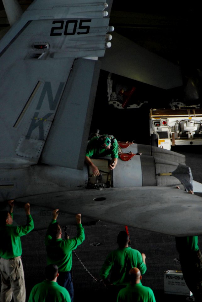 US Navy 070312-N-3659B-020 Aviation Structural Mechanic 2nd Class Marco Drake, from Charleston, Ill., performs maintenance on an F-A-18E Super Hornet, assigned to the Eagles of Strike Fighter Squadron (VFA) 115