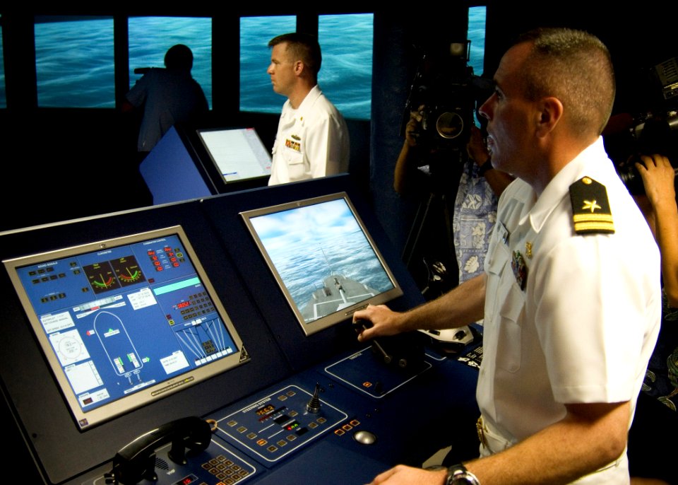 US Navy 070314-N-4856G-009 Lt. Bob Arias, assigned to Afloat Training Group Middle Pacific (ATG MIDPAC), explains the capabilities of the Navigation, Seamanship and Shiphandling Trainer (NSST)
