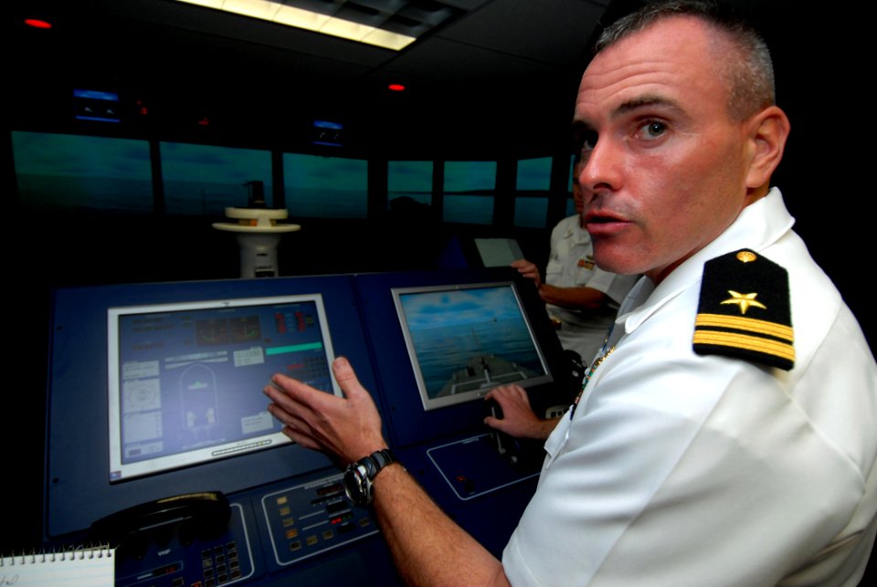 US Navy 070314-N-4965F-001 Lt. Bob Arias, assigned to Afloat Training Group Middle Pacific (ATG MIDPAC), explains the capabilities of the Navigation, Seamanship and Shiphandling Trainer (NSST)