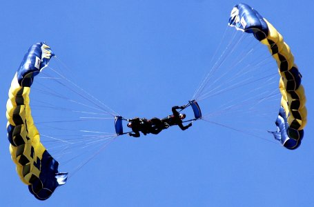 US Navy 070308-N-4163T-147 Members of the U.S. Navy Parachute Demonstration Team Leap Frogs descend into San Diego's Qualcomm Stadium during a training session photo