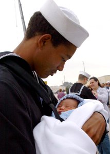US Navy 070309-N-8544C-022 Seaman John Neal embraces his son for the first time at the homecoming ceremony for guided missile frigate USS Taylor (FFG 50)