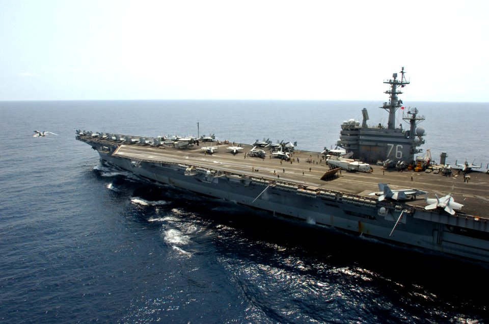 US Navy 070313-N-5961C-001 USS Ronald Reagan (CVN 76) transits in the South China Sea as an F-A-18 Hornet launches off her catapult