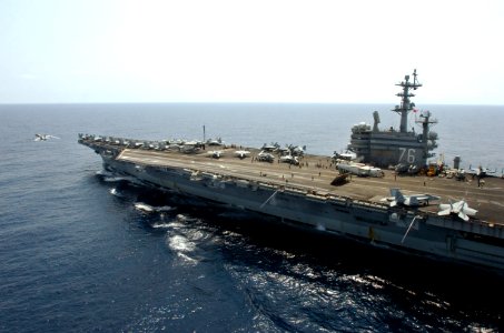 US Navy 070313-N-5961C-001 USS Ronald Reagan (CVN 76) transits in the South China Sea as an F-A-18 Hornet launches off her catapult