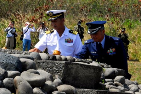 US Navy 070314-N-4124C-084 Japan Maritime Self Defense Force (JMSDF) Capt. Tomonori Kudo and Japan Air Self Defense Force (JASDF) Col. Shigemitsu Kurauchi conduct a Japanese ritual of spiritual purification photo