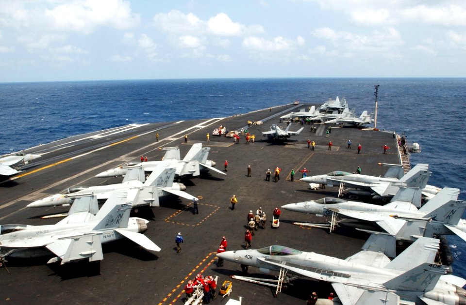 US Navy 070312-N-4009P-002 On the flight deck of Nimitz-class aircraft carrier USS Ronald Reagan (CVN 76), Sailors work during a long day of flight operations