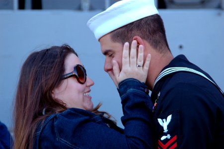 US Navy 070313-N-4047W-148 Torpedoman's Mate 2nd Class Tyson Hinkley is greeted by his wife during the homecoming of guided missile cruiser USS Bunker Hill (CG 52)