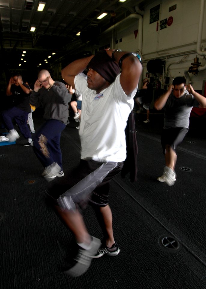 US Navy 070315-N-1226D-043 Intelligence Specialist 1st Class Travoric Smith from Odessa, Texas, exercises during the Fitness Enhancement Program aboard USS Bonhomme Richard (LHD 6) hangar bay