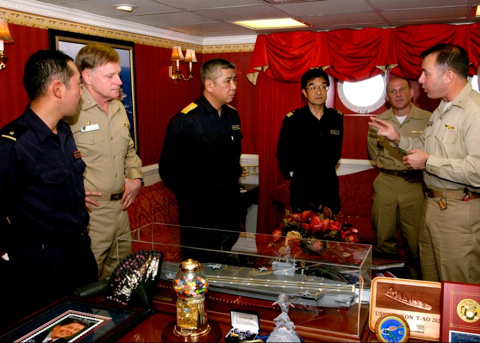 US Navy 070316-N-4009P-040 Commanding Officer Capt. Terry B. Kraft, speaks to Rear Adm. Yukitaka Miyazaki inside his office onboard the Nimitz-class aircraft carrier USS Ronald Reagan (CVN 76)
