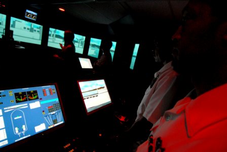 US Navy 070314-N-4965F-009 Chief Quartermaster Scott Ramsey and Boatswain's Mate 1st Class Cliff Monroe, both assigned to Afloat Training Group Middle Pacific (ATG MIDPAC), man the lee helm and helmsman positions of a bri