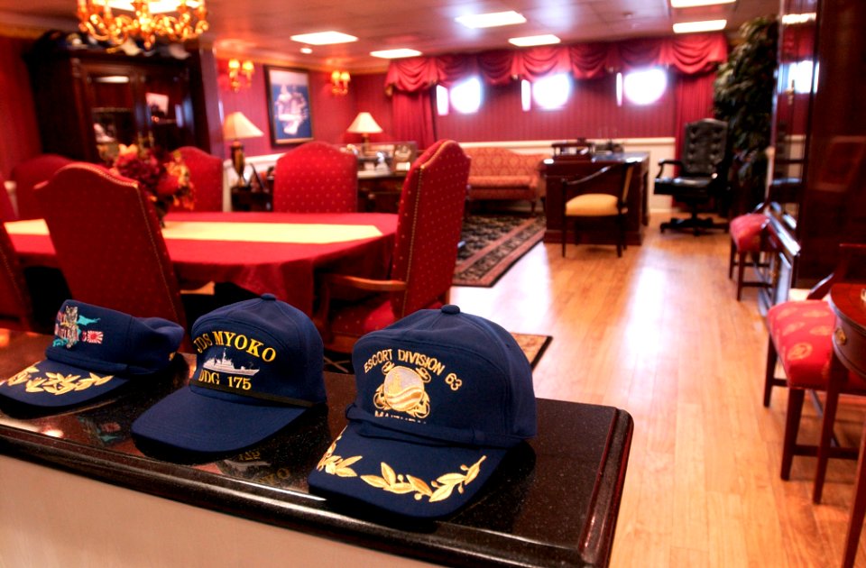 US Navy 070316-N-9712C-001 Hats belonging to Japan Maritime Self Defense Force (JMSDF) officials sit on top of the counter in the commanding officer's office while their owners tour Nimitz-class aircraft carrier USS Ronal