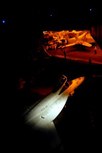 US Navy 070317-N-2959L-357 During the night, air department personnel aboard Nimitz-class aircraft carrier USS Ronald Reagan (CVN 76) work carefully to move an F-A-18E Super Hornet from the flight deck to hanger bay three
