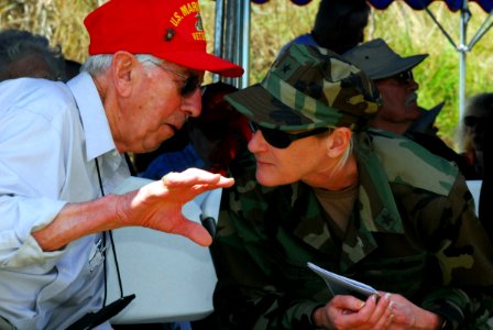 US Navy 070314-N-4124C-013 Expeditionary Strike Group 7 Commander Rear Adm. Carol M. Pottenger speaks with veteran Maurice L. Richardson, an Iwo Jima survivor, at the 62nd Commemoration of the Battle of Iwo Jima