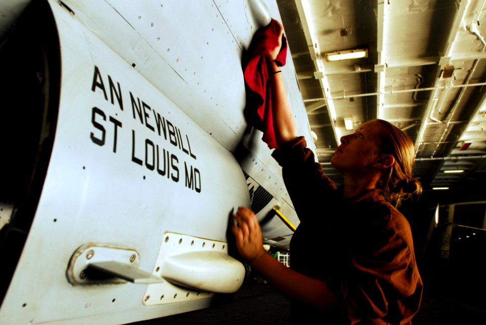 US Navy 070315-N-9928E-086 Aviation Maintenance Administrationman Lindsay Honea performs routine maintenance and upkeep on an F-A-18C Hornet, assigned to the Blue Diamonds of Strike Fighter Squadron (VFA) 146