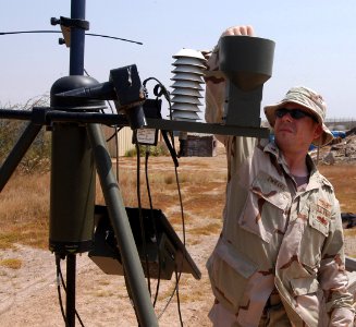 US Navy 070317-N-1003P-003 Aerographer's Mate 1st Class Christian Zwiegel of Combined Joint Task Force-Horn of Africa performs monthly maintenance on the Tactical Meteorological Observation System on board Camp Lemonier