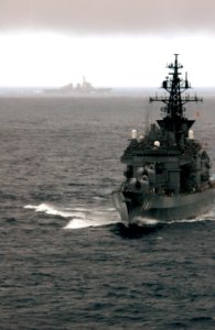 US Navy 070317-N-1635S-001 Rain clouds loom overhead as the Japan Maritime Self Defense Force (JMSDF) ship JS Haruna (DDH 141) pulls alongside the Nimitz-Class aircraft carrier USS Ronald Reagan (CVN 76) during a passing exerci
