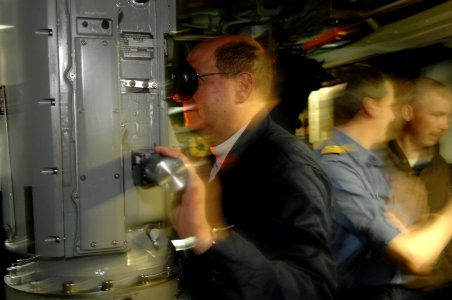 US Navy 070318-N-3642E-044 Secretary of the Navy (SECNAV), the Honorable Dr. Donald C. Winter looks through the periscope of Los Angeles-class fast attack submarine USS Alexandria (SSN 757) photo