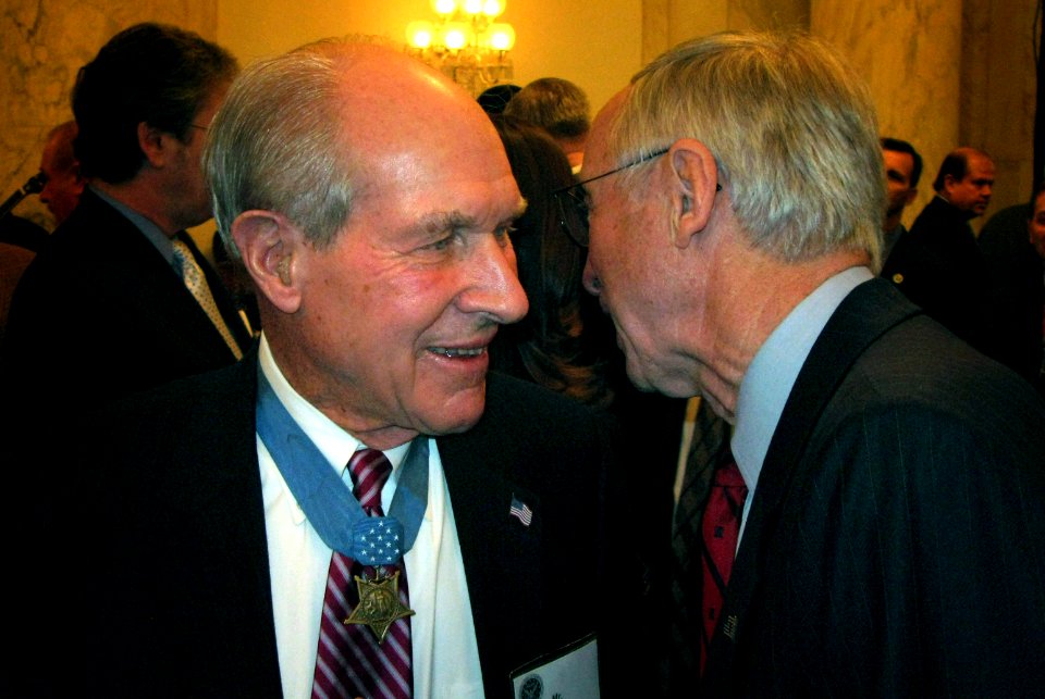 US Navy 070322-D-0000X-001 Deputy Defense Secretary Gordon England talks with Medal of Honor recipient Thomas Hudner at a ceremony honoring recipients of the nation's highest military award for bravery