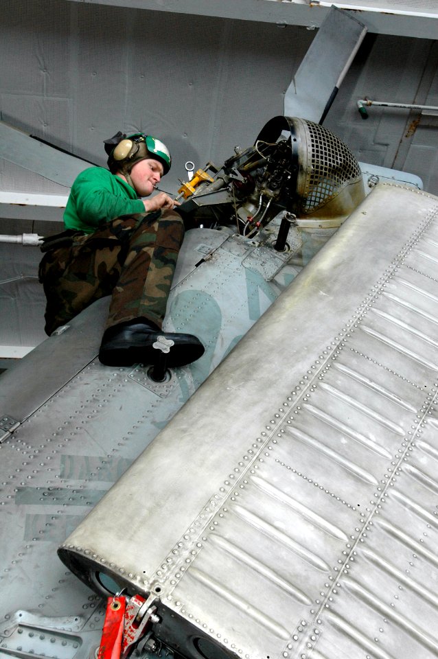 US Navy 070317-N-1635S-003 Aviation Structural Mechanic 2nd Class Justin Loftis of Sheridan, Mont., performs a tail rig check on a SH-60F Seahawk, assigned to the Black Knights of Helicopter Anti-Submarine Squadron (HS) 4, in t