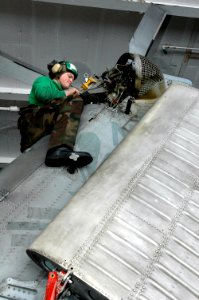 US Navy 070317-N-1635S-003 Aviation Structural Mechanic 2nd Class Justin Loftis of Sheridan, Mont., performs a tail rig check on a SH-60F Seahawk, assigned to the Black Knights of Helicopter Anti-Submarine Squadron (HS) 4, in t