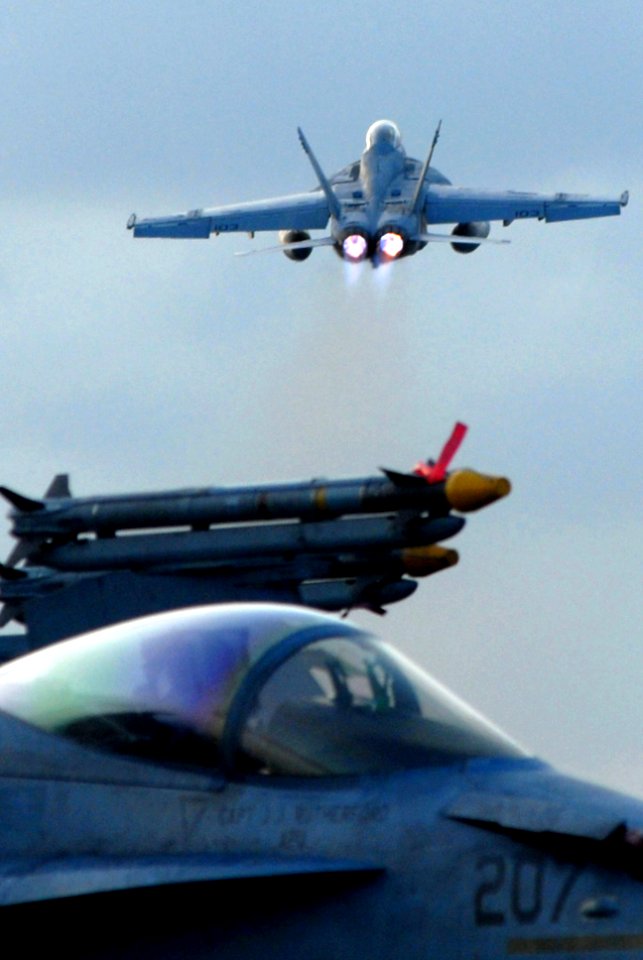 US Navy 070319-N-2659P-294 An F-A-18F Super Hornet, assigned to the Black Knights of Strike Fighter Squadron (VFA) 154, launches from the flight deck of Nimitz-class aircraft carrier USS John C. Stennis (CVN 74)