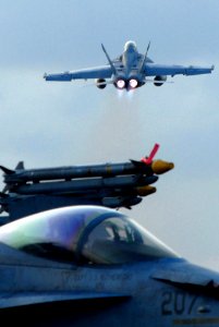 US Navy 070319-N-2659P-294 An F-A-18F Super Hornet, assigned to the Black Knights of Strike Fighter Squadron (VFA) 154, launches from the flight deck of Nimitz-class aircraft carrier USS John C. Stennis (CVN 74)