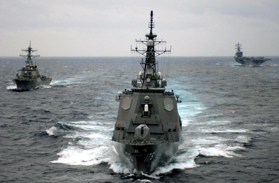 US Navy 070318-N-5961C-237 Japan Maritime Self Defense Force (JMSDF) ship JS Haruna (DDH 141), USS Russell (DDG 59) and USS Ronald Reagan (CVN 76) steam in formation during a photo exercise (PHOTOEX) between the Ronald Reagan C