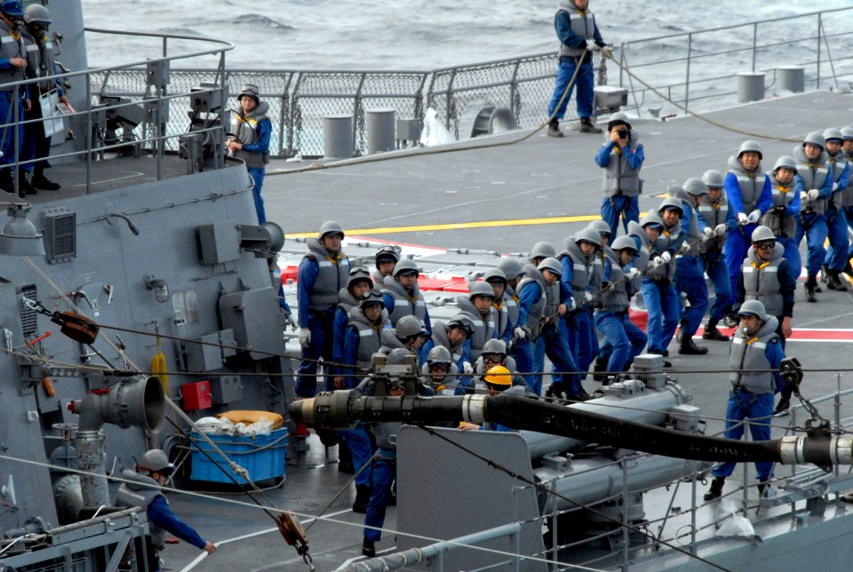 US Navy 070317-N-7730P-217 Sailors aboard Japan Maritime Self Defense Force (JMSDF) ship JS Myoko (DDG 175) pull the messenger line to set a fuel probe during a mock fueling at sea (FAS) exercise with Nimitz-class aircraft car