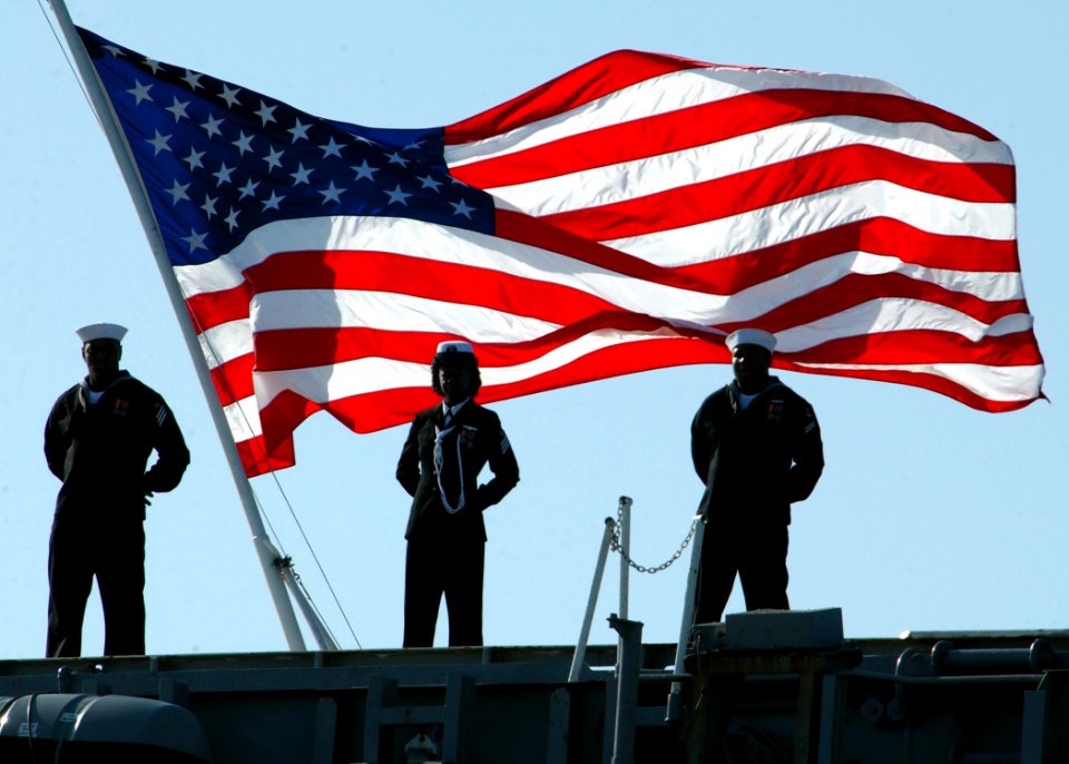 US Navy 070323-N-3285B-017 Sailors stationed aboard USS John F. Kennedy (CV 67) man the rails during the ship's decommissioning ceremony