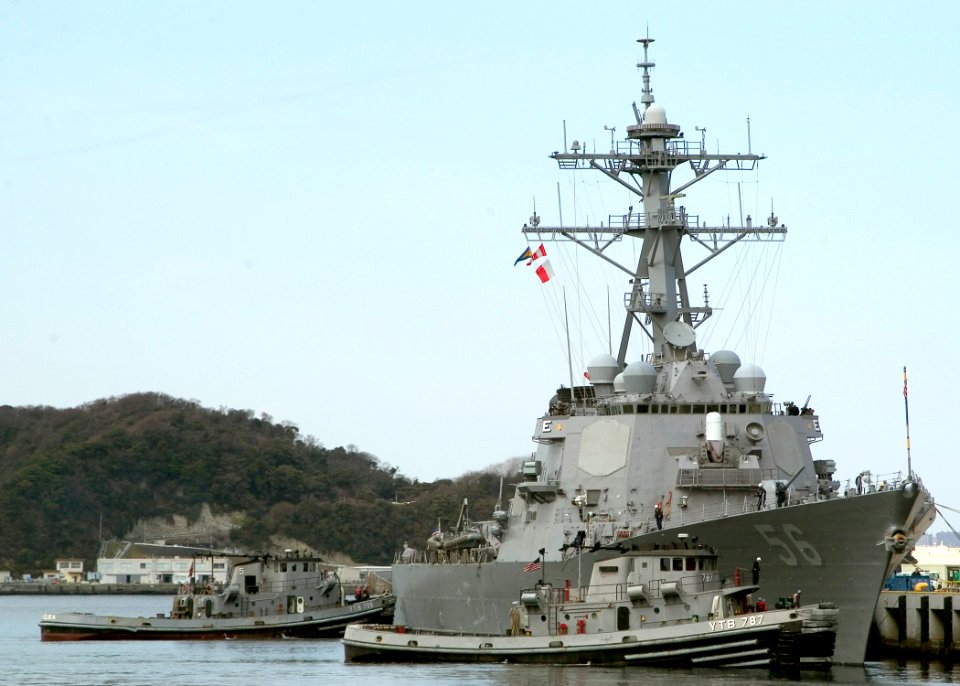 US Navy 070319-N-0483B-001 Large harbor tugs assist Arleigh Burke-class guided missile destroyer USS John S. McCain (DDG 56) as she departs Commander Fleet Activities Yokosuka