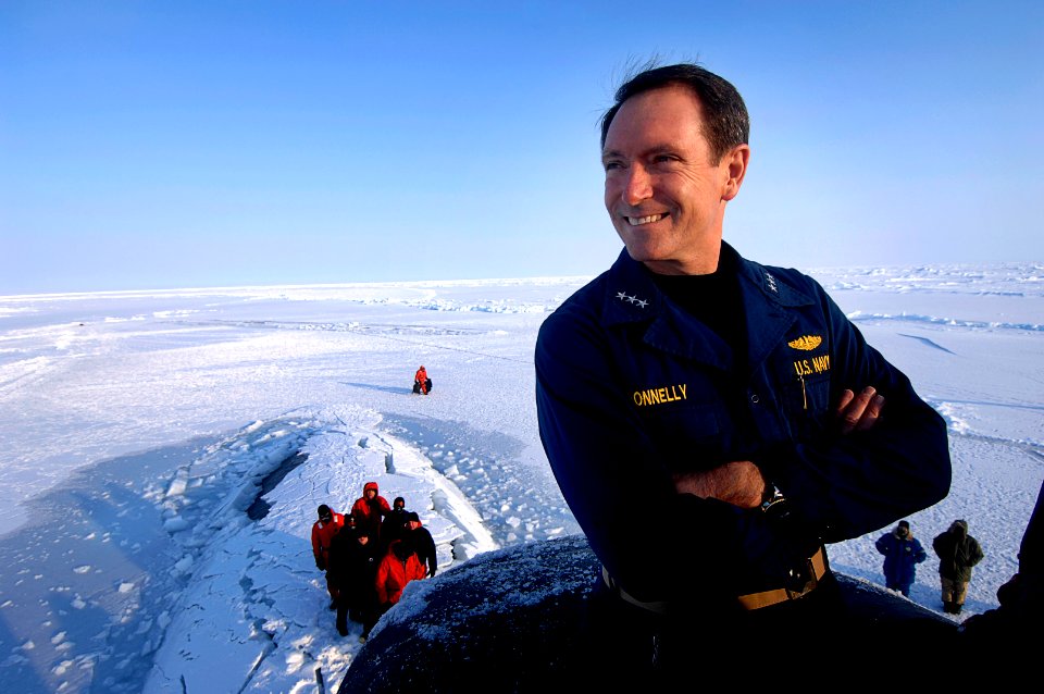 US Navy 070318-N-3642E-343 Commander, Submarine Force, Vice Adm. John Donnelly looks over the frozen Arctic Ocean from the bridge of attack submarine USS Alexandria (SSN 757)
