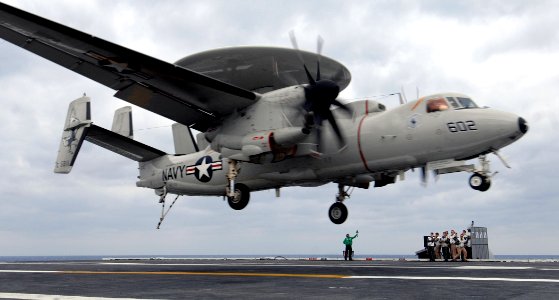 US Navy 070321-N-5345W-031 Landing Signal Officers (LSO) watch as an E-2C Hawkeye assigned to the Seahawks of Carrier Airborne Early Warning Squadron (VAW) 126 approaches for an arrested recovery