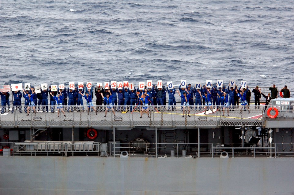 US Navy 070318-N-1635S-009 Off the port side of USS Ronald Reagan (CVN 76), Japan Maritime Self Defense Force (JMSDF) ship JS Hamagiri (DD 155) sailors show off some of their talent while participating in a pass in review of sh