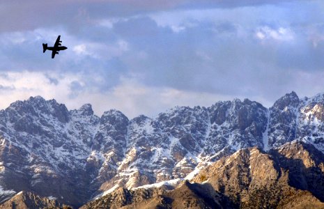 US Navy 070322-F-3961R-018 A C-130 Hercules aircraft maneuvers to land at Bagram Airfield, Afghanistan photo