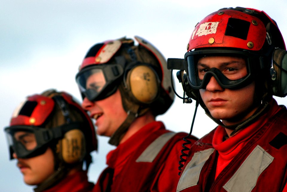 US Navy 070319-N-2659P-279 Sailors assigned to weapons department watch flight operations while standing by to arm or disarm ordnance on taxiing aircraft aboard Nimitz-class aircraft carrier USS John C. Stennis (CVN 74)