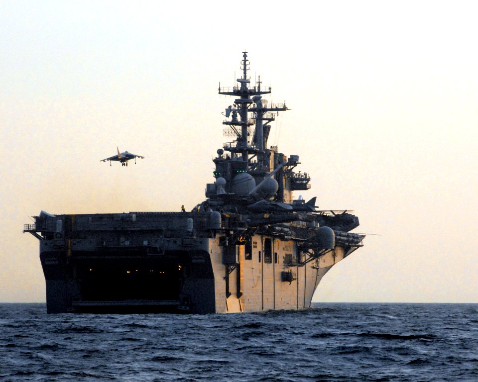 US Navy 070327-N-0841E-102 An AV-8B Harrier II from Marine Medium Helicopter Squadron (HMM) 261 prepares to land aboard amphibious assault ship USS Kearsarge (LHD 3)