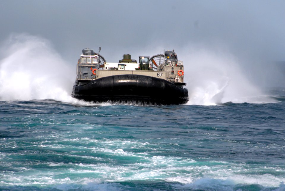 US Navy 070327-N-0841E-051 A landing craft air cushion (LCAC) from Landing Craft Unit 4 prepares to dock in the well deck of amphibious assault ship USS Kearsarge (LHD 3)