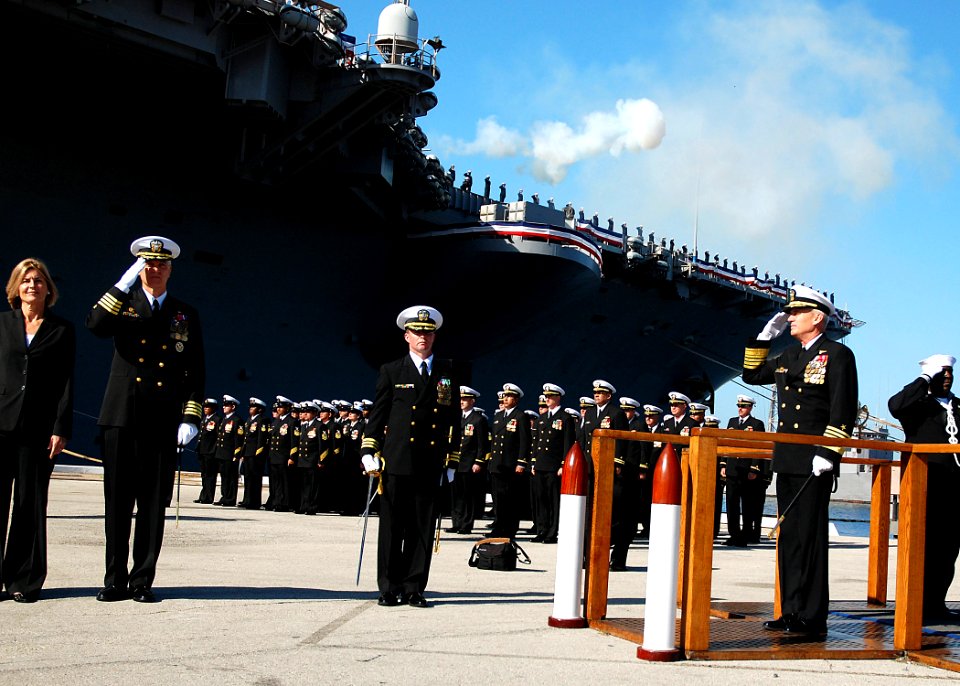 US Navy 070323-N-4565G-002 Commander, U.S. Fleet Forces Command, Adm. John B. Nathman walks through the ceremonial quarterdeck as the a .40-caliber 17-gun salute is conducted from the flight deck prior to the decommissioning ce